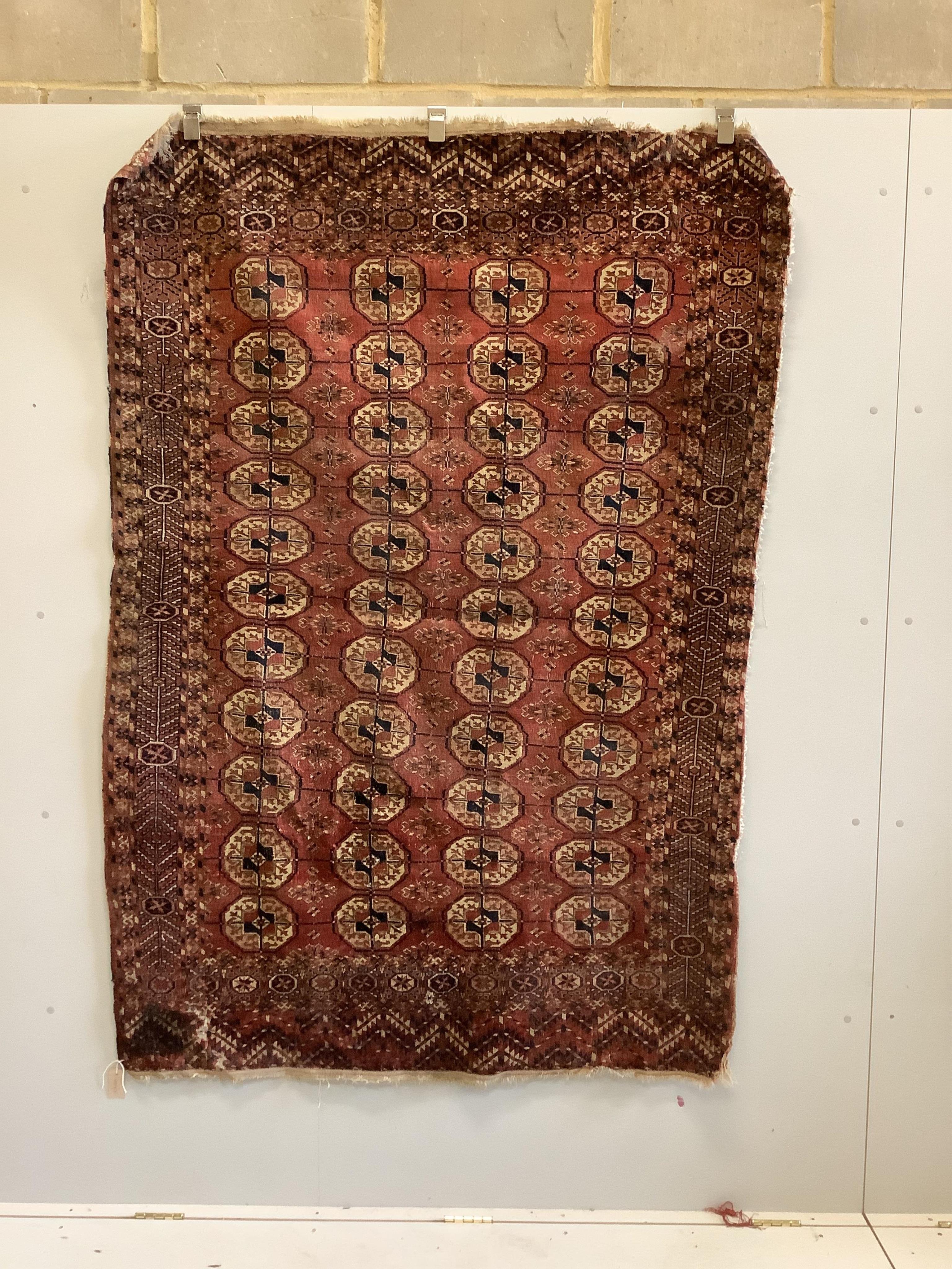 An antique Tekke Turkmen rug, 200 x 136cm. Condition - poor-fair